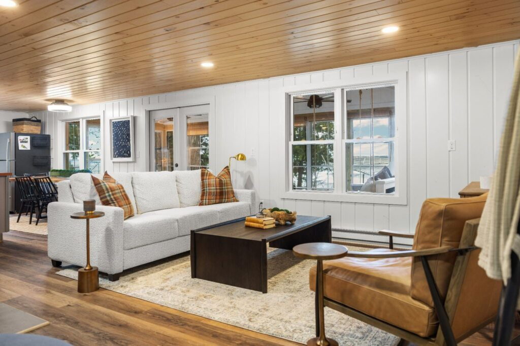 Warm wood tones, cozy layers, and just the right little pop of color.

This living room brings together everything we love about cabin style: relaxed textures, grounded tones, and a space that feels comfortable without trying too hard.