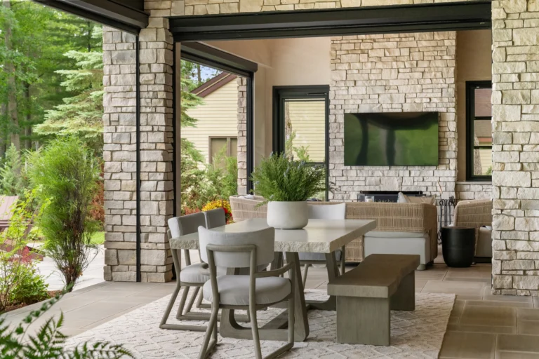 Built for long dinners, slow mornings, and everything that happens in between.
This indoor-outdoor space on Higgins Lake blends natural textures, comfortable seating, and an easy connection to the lake, creating a place that feels just as good for gathering as it does for unwinding.

@harborviewcustombuilders 
@bernhardtfurniture