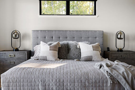 A grounded take on comfort.

Darker wood tones, soft bedding, and layered textures bring depth to this bright bedroom, creating a space that feels calm, cozy, and thoughtfully balanced.