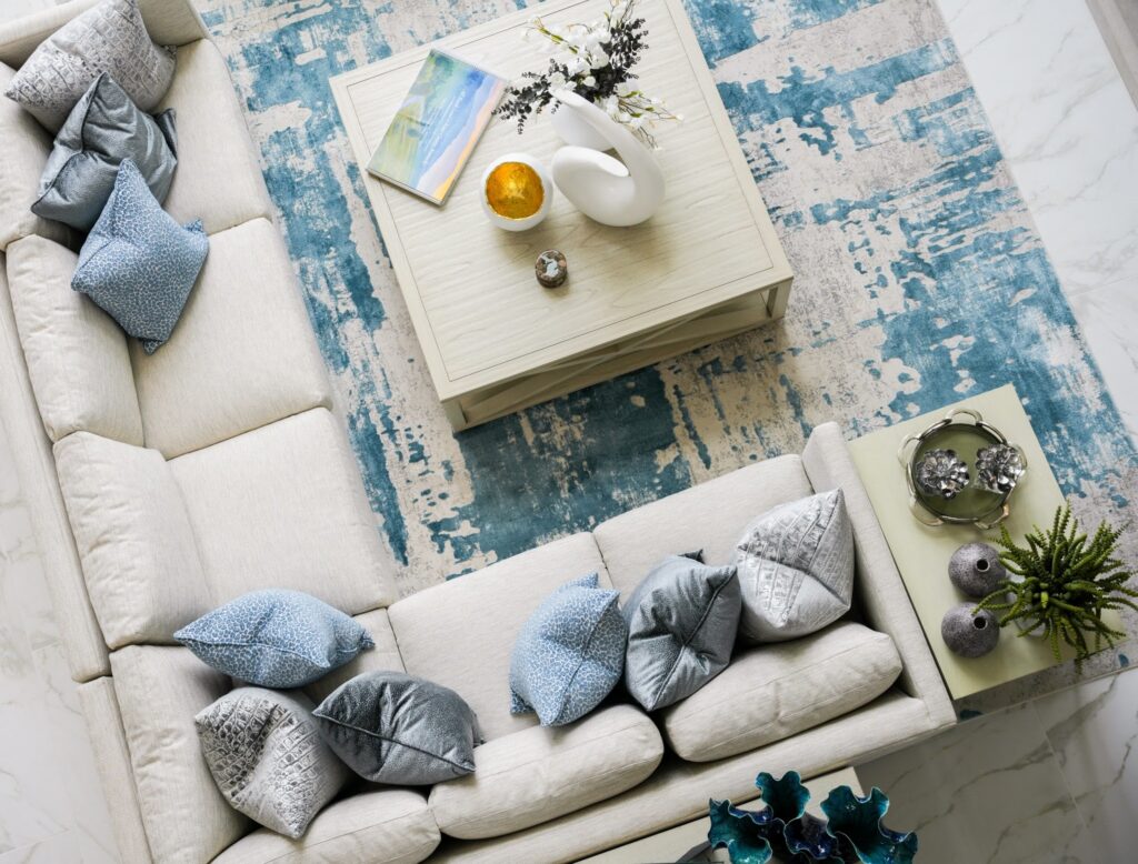 A living room layered in soft neutrals, coastal blues, and textures that make the whole space feel calm, collected, and complete.

From the pillows to the rug to the finishing pieces, every detail works together to create a room that feels easy to live in and beautiful to come home to.

Stop into Quiet Moose and find the pieces that bring your space together.