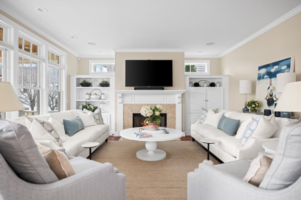 Bright, calm, and made for gathering.

This space blends soft neutrals, layered textures, and subtle blue accents to create a living room that feels polished but still incredibly comfortable. With natural light pouring in and every detail working together, it’s the kind of room that feels easy to settle into.